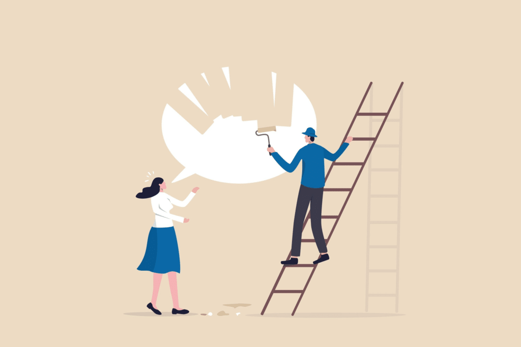 A cartoon woman is trying to speak, represented by a large, white word bubble. A cartoon man is standing on a ladder, painting over the bubble with the background color.